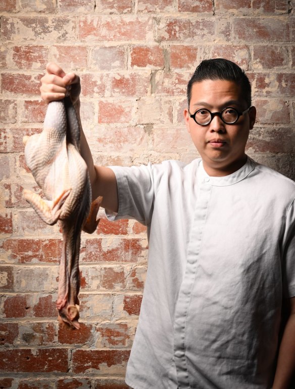 Victor Liong at Lee Ho Fook with a raw cockerel.  
