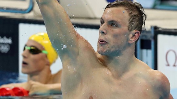 As Chalmers celebrates, McEvoy, in the background, stares at the scoreboard.