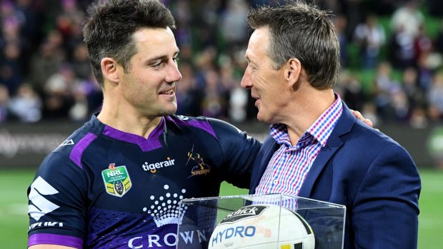 Honoured: Craig Bellamy presents Cooper Cronk with the match ball.