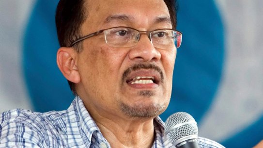 Malaysia's former deputy prime minister Anwar Ibrahim delivers a by-election campaign speech in 2007.