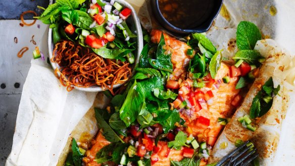 Paper-baked salmon with salsa of Asian herbs.