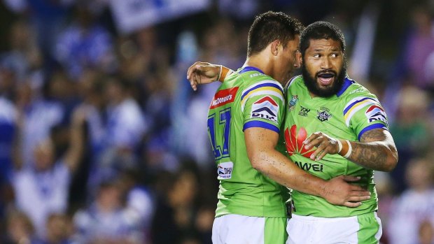 Frank-Paul Nuuausala and Joseph Tapine of the Raiders celebrate at full time during the round five NRL match between the Canterbury Bulldogs and the Canberra Raiders.