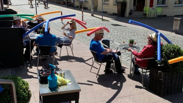Cafe Rothe in Schwerin, Germany, went viral after it showed customers wearing hats with pool noodles attached.