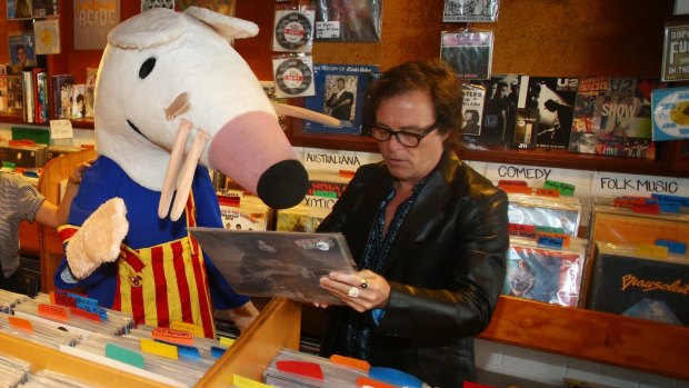 Brad Shepherd of the Hoodoo Gurus helps Maisy the Mouse to pick up some vinyls ahead of Dress Up Attack! festival.