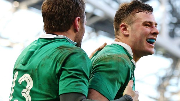Ireland's Jared Payne and Robbie Henshaw celebrate scoring a try against England.