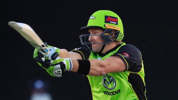 Letting rip: Shane Watson hits out for the Thunder as the Sydney side post 5-166 in Launceston.