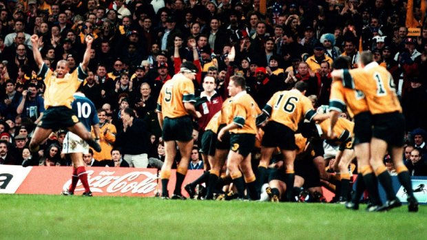 Glory days: George Gregan and Wallaby players celebrate a try by Owen Finegan against France.