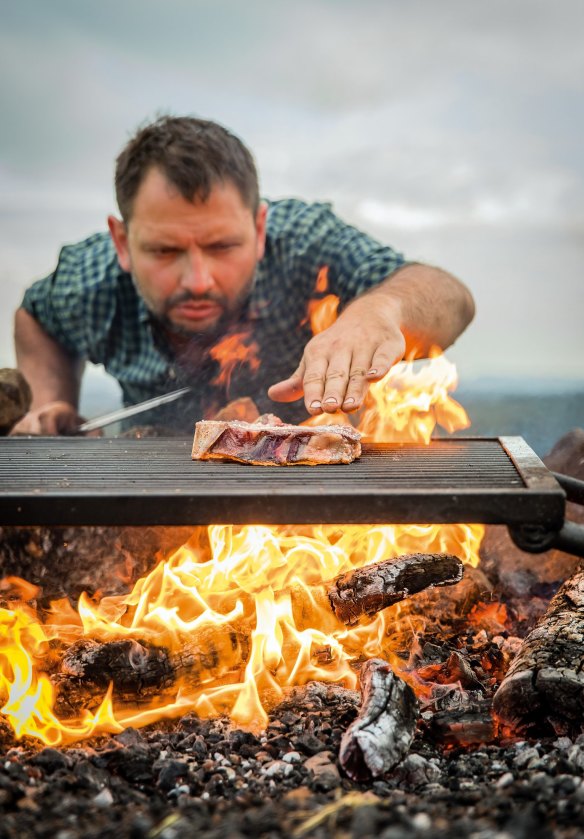 Lennox Hastie cooking over fire, from his book, Finding Fire.