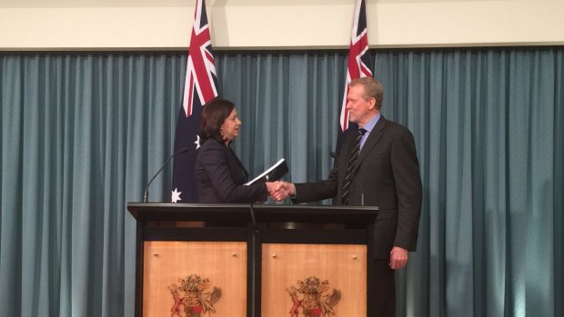 Greyhound commission of inquiry chairman Alan McSporran, QC, delivers his report to Premier Annastacia Palaszczuk.