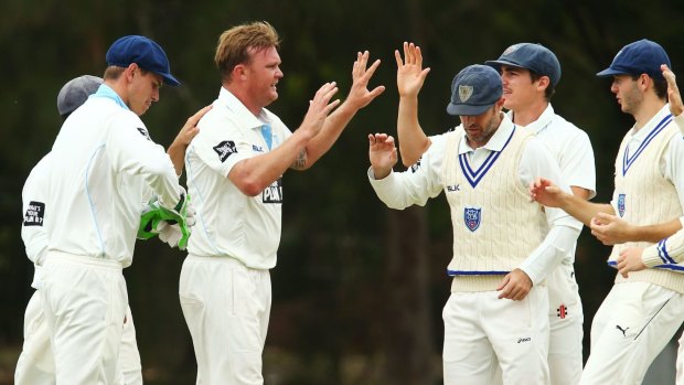 Breakthrough: Doub Bollinger celebrates a wicket on day one of the Shield clash.  He claimed a crucial scalp early on day three when Beau Webster went for eight.