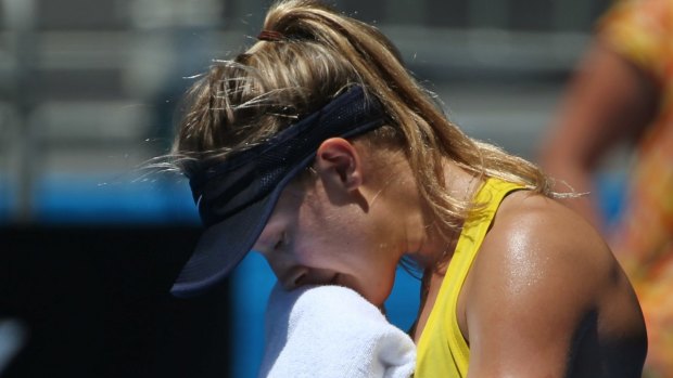 Throw in the towel: Eugenie Bouchard of Canada suffers in the sun at Melbourne Park.