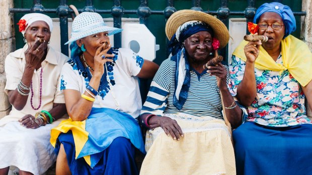Women enjoying their cigars in Havana. There won't be any new restrictions on the importation into the US of cigars for personal use.  