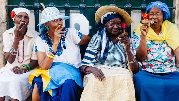 Women enjoying their cigars in Havana. There won't be any new restrictions on the importation into the US of cigars for personal use.  