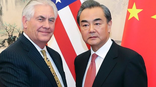 Chinese Foreign Minister Wang Yi (right), meets with US Secretary of State Rex Tillerson in Beijing Saturday.