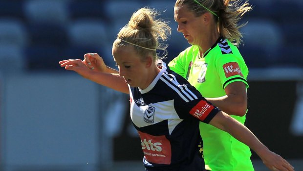 Hannah Brewer (left) in her Melbourne Victory days against Canberra United.