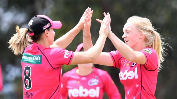 All grand: Ireland's Kim Garth (right) celebrates with Ellyse Perry.