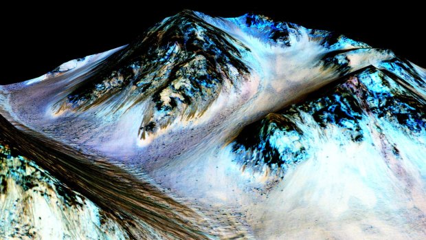 This undated photo provided by NASA shows dark, narrow, 100 meter-long streaks on the surface of Mars that scientists believe were caused by flowing streams of salty water.