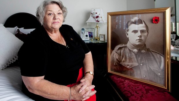 Dawn Dudkowski with a photo her grandfather Thomas Brian.