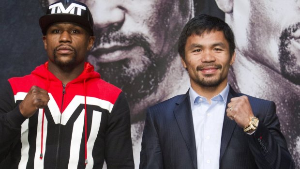 Payday ... Undefeated WBC/WBA welterweight champion Floyd Mayweather Jr (left) of the US and WBO welterweight champion Manny Pacquiao of the Philippines pose during a final news conference at the MGM Grand Resort in Las Vegas, Nevada.