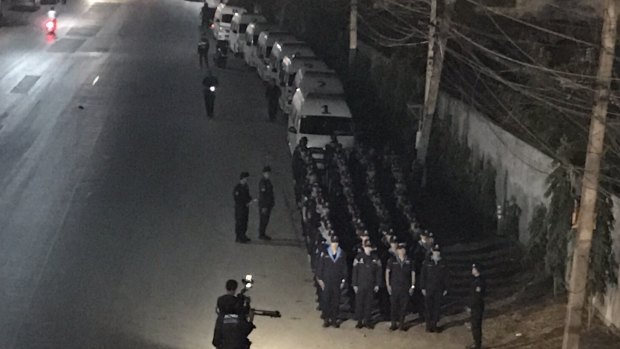 Columns of police form part of the stand-off at the temple.