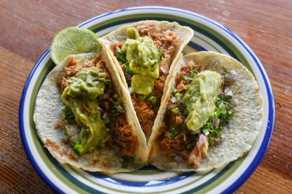 Don't miss the carnitas - slow-cooked shredded pork tacos.