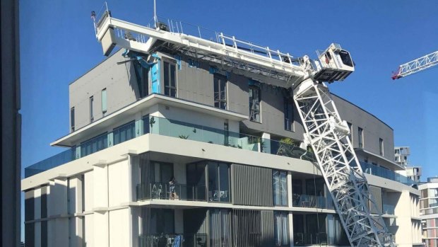 The view from a neighbouring window after the crane crashed onto the penthouse of a block of apartments at Wolli Creek.
