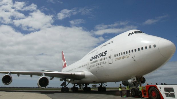 Qantas used a Boeing 747 jumbo jet for its final international flight before grounding most of its fleet.