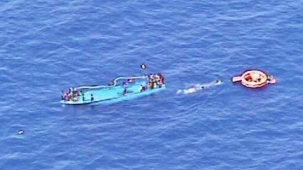 An overturned boat carrying migrants off the  coast of Libya last week. Officials said at least 20 bodies were spotted in the sea. More deaths were reported off Crete on Friday.