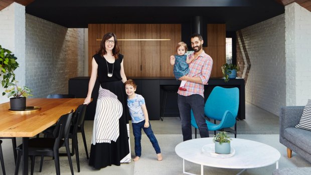 Anna, Finn, Taj and Evie at home: Anna began sketching design
ideas on the back of the real estate pamphlet even before they purchased the property in 2011. The blue “Scape” armchair is by Featherston.