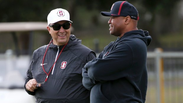 Tactics: Stanford head coach David Shaw (right) chats with special teams man Pete Alamar.