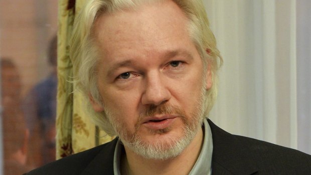 WikiLeaks founder Julian Assange gestures during a news conference at the Ecuadorian embassy in central London.