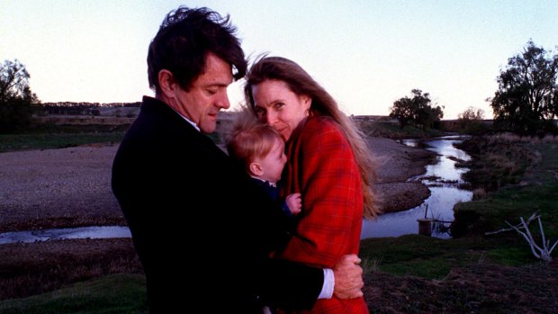 Philip Toyne and his wife Molly hug their son Atticus in 1999. 