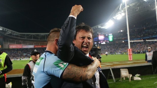 NSW players celebrate their Origin game 2 win last year with coach Laurie Daley. 