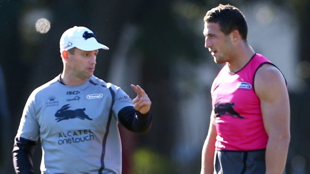 Close bond: Michael Maguire talks with Sam Burgess at training.