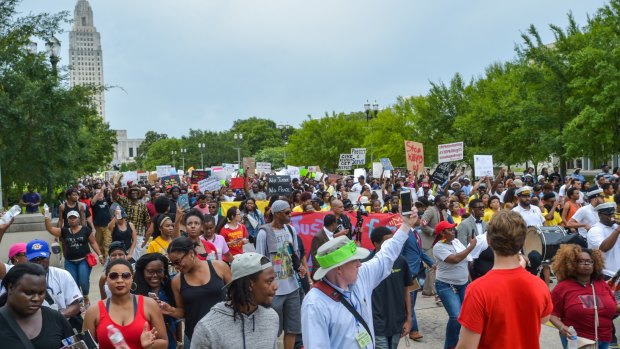 Protesters march to the state capitol in Baton Rouge, Louisiana, on Sunday.