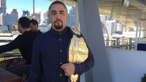 The champ is here: Robert Whittaker poses with the interim middleweight title.