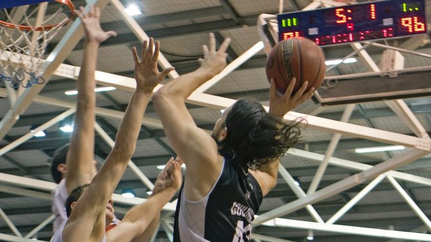 Flying finish: Chris Goulding flies toward the basket and is fouled. He converted one free throw to win the game for Melbourne United. 