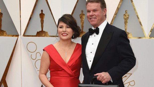 Martha Ruiz, left, and Brian Cullinan from PwC: Cullinan accidentally handed presenter Warren Beatty a duplicate of the envelope for best actress. 