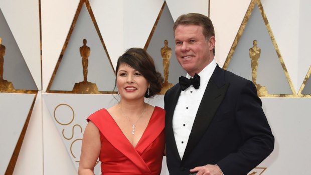 Martha L. Ruiz, left, and Brian Cullinan from PricewaterhouseCoopers arrive at the Oscars.