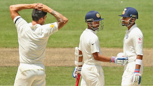 Sweet nothings: Mitchell Johnson and Virat Kohli catch-up.