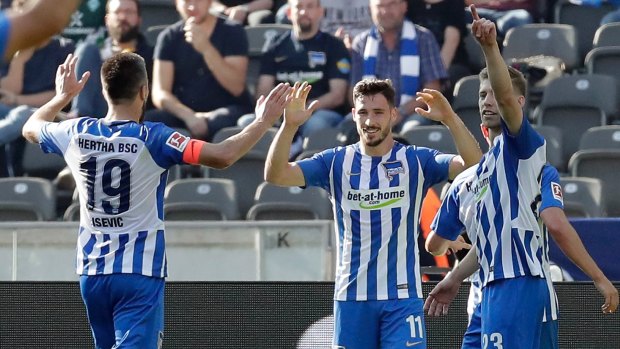 Hertha's scorer Mathew Leckie (second  right) and his teammates celebrate.