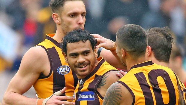 On target: Cyril Rioli of the Hawks celebrates after kicking a goal against the Demons.
