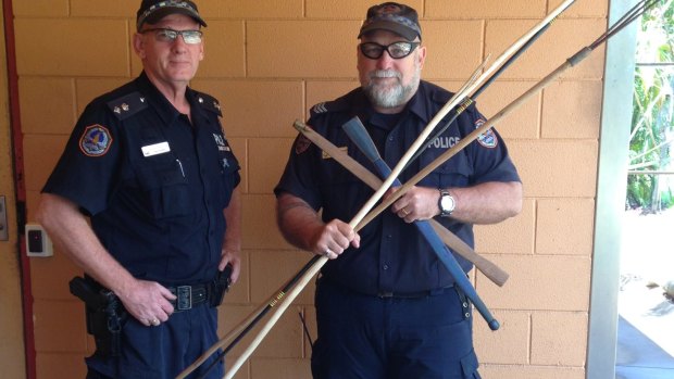 Acting Superintendent Steve Hayworth and Acting Senior Sergeant Owen Blackwell with a number of the weapons confiscated following the fatal brawl.
