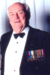 John Beams wearing his service medals.