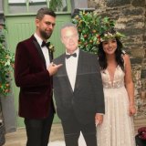 Neighbors-mad Gareth Rainey and his wife Karen at their wedding in Belfast where a life-size Paul Robinson welcomed guests. 
