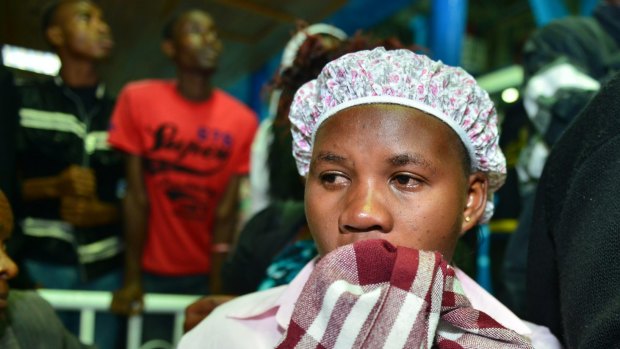 An anxious relative waits for students rescued from Garissa University College after the massacre. 