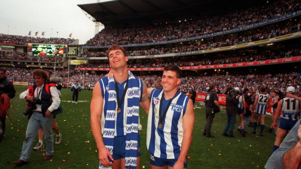 Wayne Carey and Anthony Stevens as teammates, after the 1996 Grand Final won by North Melbourne.