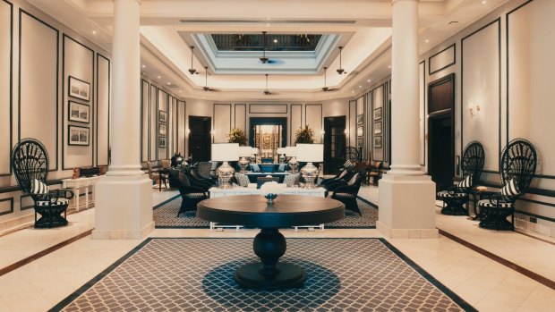 The colonnaded entrance at The Strand, Yangon: A splendid lobby of great size and elegance while unashamedly reminiscent of a bygone era.