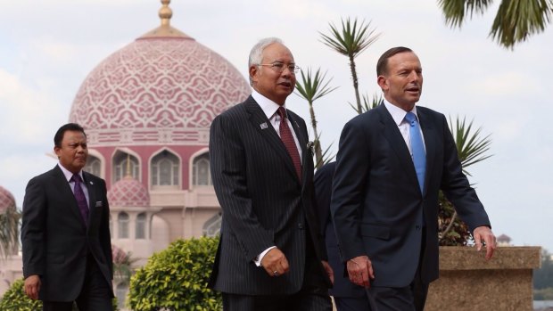 Prime Minister Tony Abbott was greeted by Malaysian Prime Minister Najib Razak in Kuala Lumpur in September last year. 