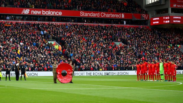 Liverpool and Watford observe a minute's silence for Remembrance Day.